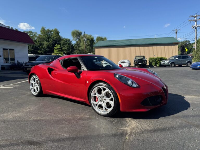 Red sports car repaired at John's Auto Restoration shop.