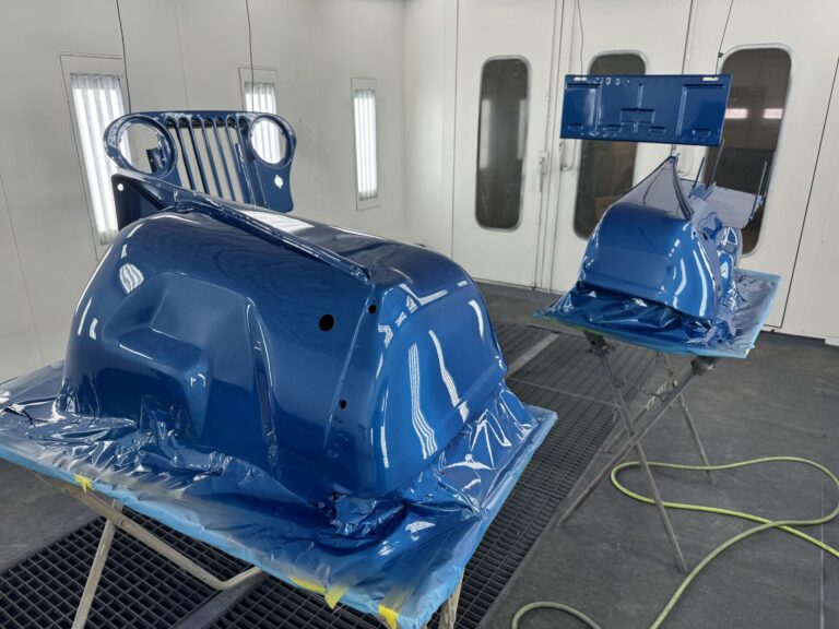 Auto body parts being painted at John's Automotive.