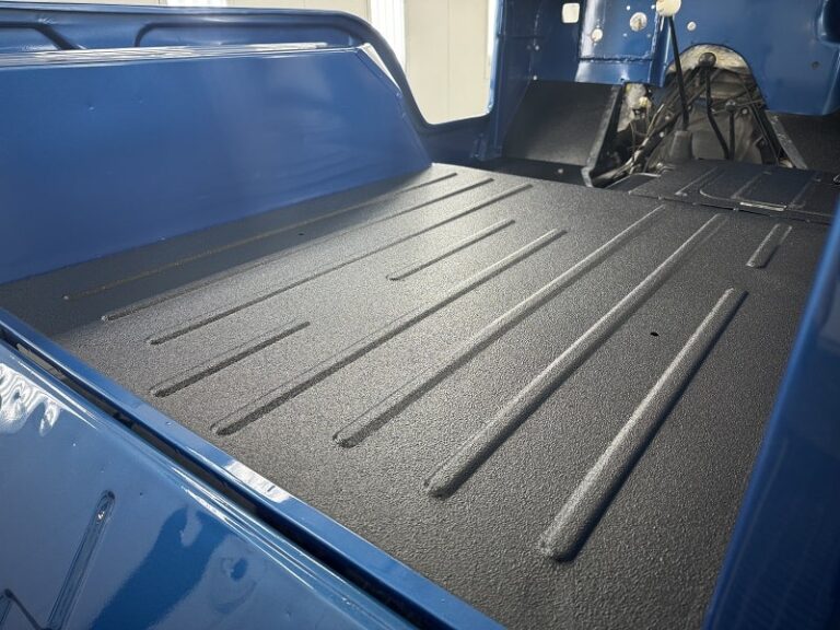 Truck bed with fresh protective coating and bed liner at John's Auto Restorations.