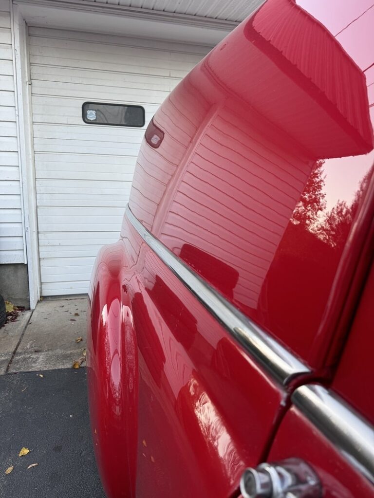 Red truck with polished exterior and chrome accents.
