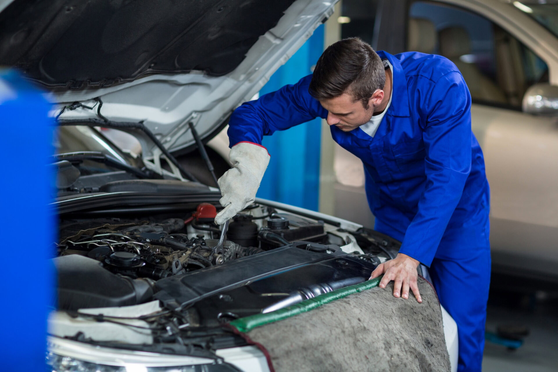 Expert mechanic performing engine repairs