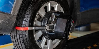 Automotive wheel alignment being performed at Kabayan Auto Repair LTD.
