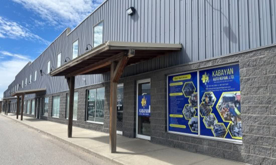 Exterior view of Kabayan Auto Repair LTD workshop with signage and building facade.