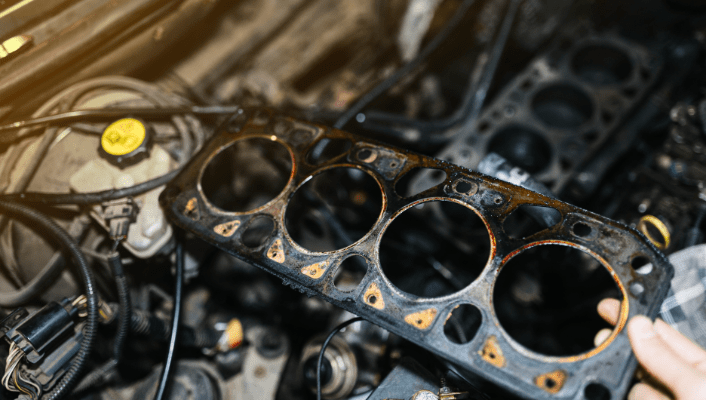 Automotive engine repair with cylinder head gasket replacement service.