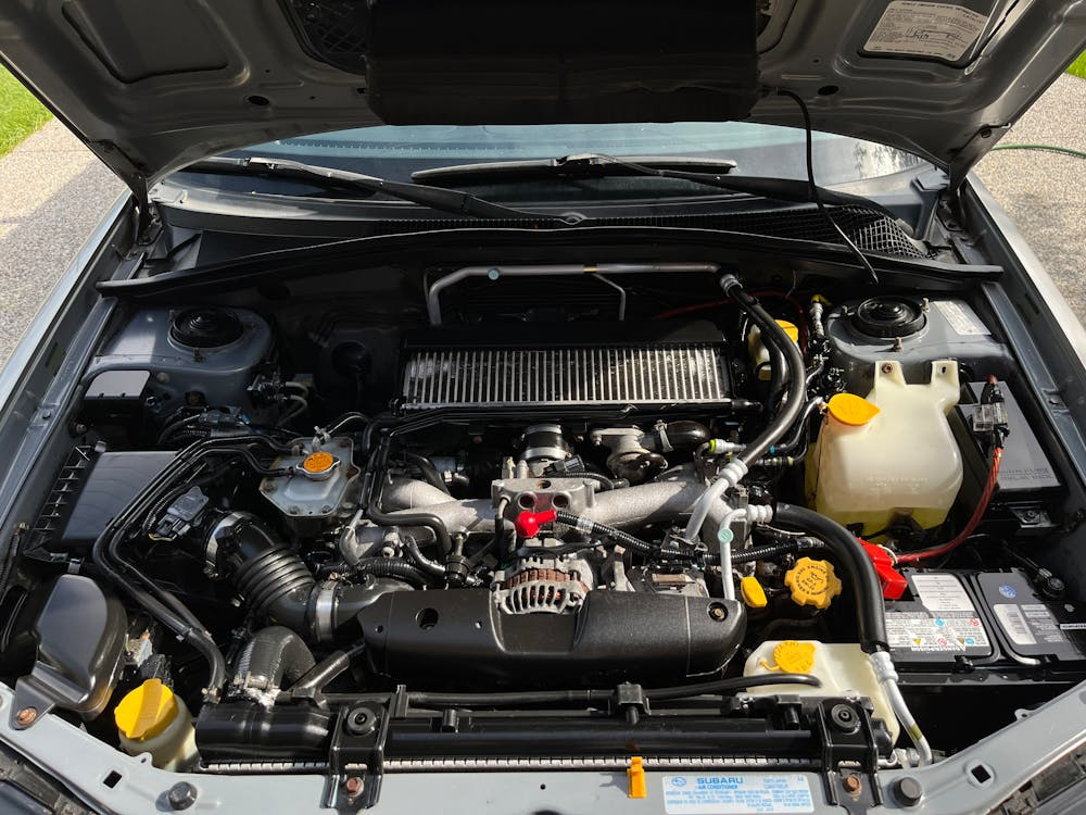 Engine compartment of a modern vehicle at Kevin and Kayla's Automotive.