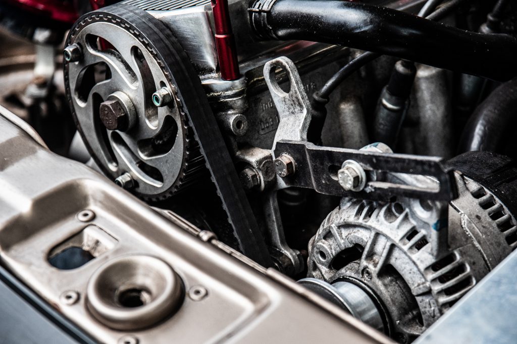 Engine components and timing belt at Kevin and Kayla's Automotive.