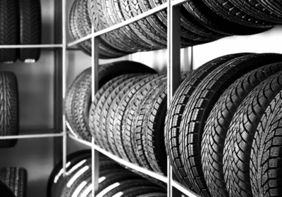 Tires displayed on shelves at K Tire Pro, showcasing a variety of high-quality tires for different v.