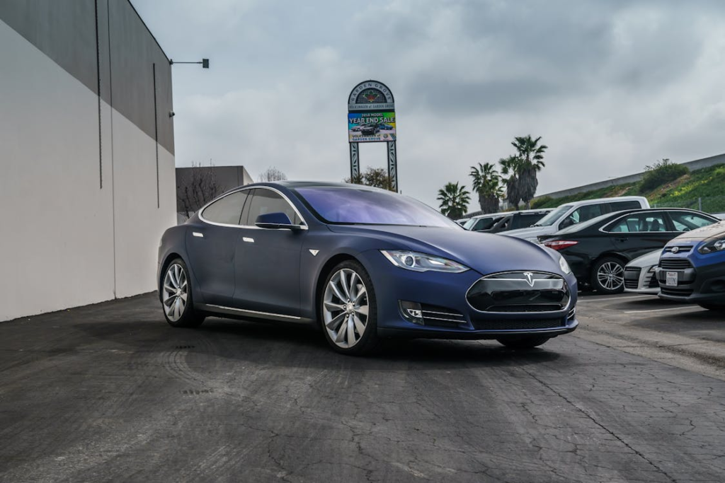 Tesla Model S EV with specialized tires for electric vehicle efficiency.
