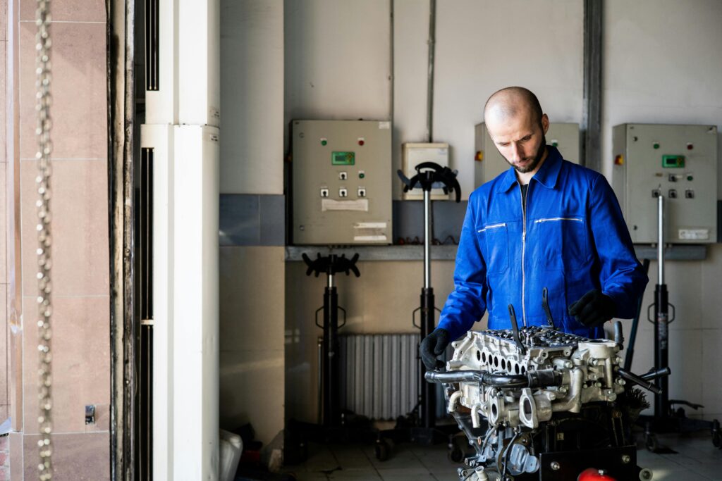 Automotive technician inspecting vehicle brake system for safety and performance.