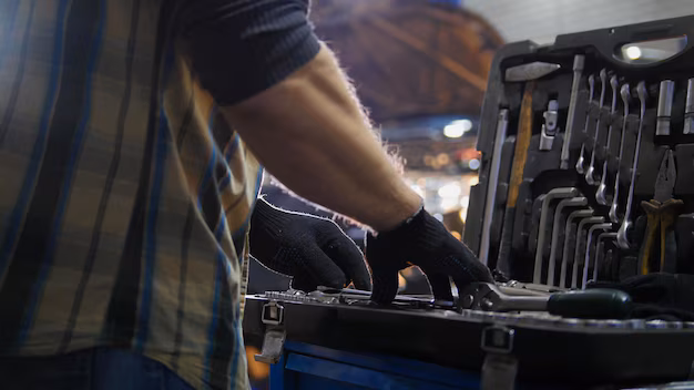 Car service mechanic checking tools in a workshop tool case