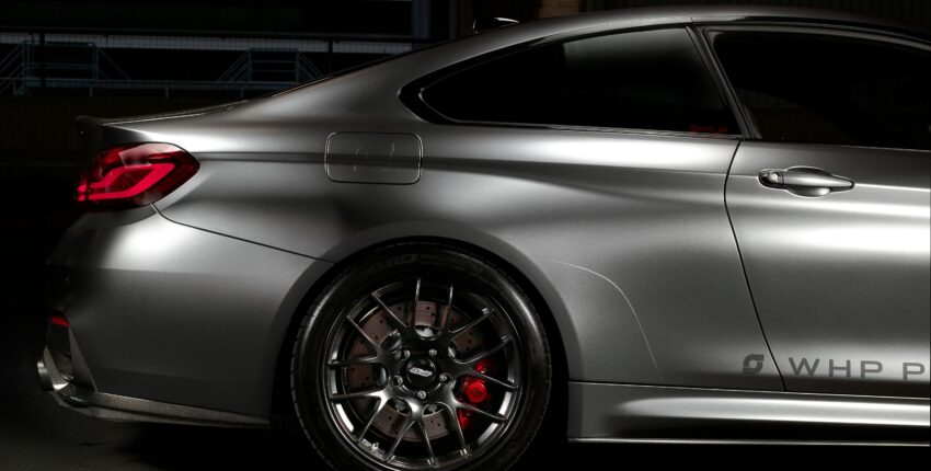 High-performance car with custom wheels at MADA Autosport, vehicle inspection experts.