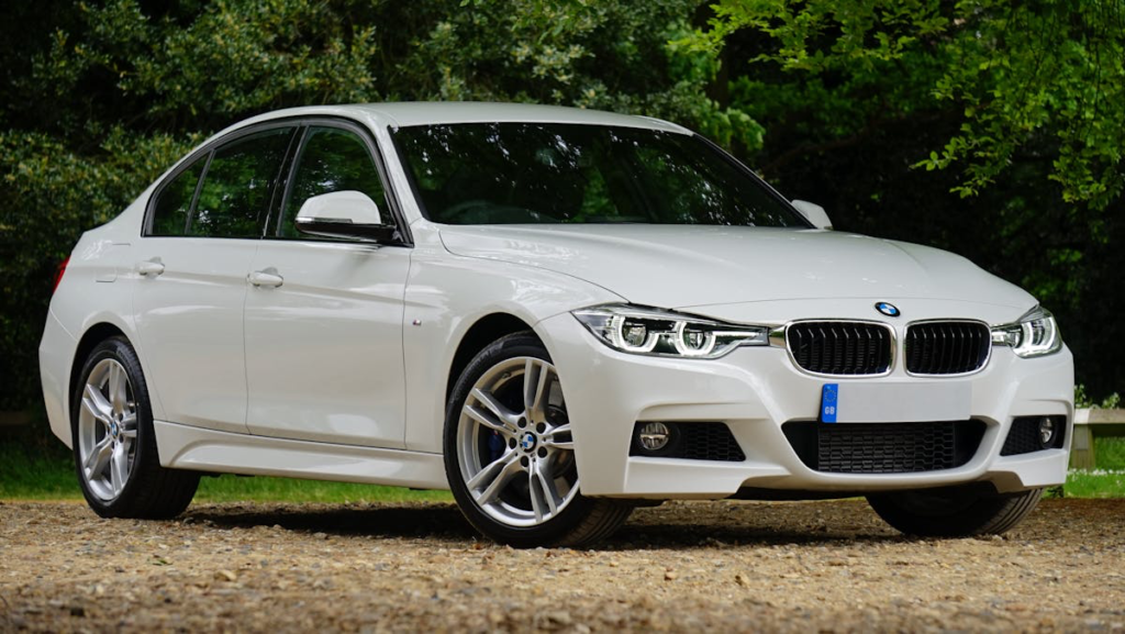 White BMW sedan parked outdoors, ready for electrical diagnosis and repair services.