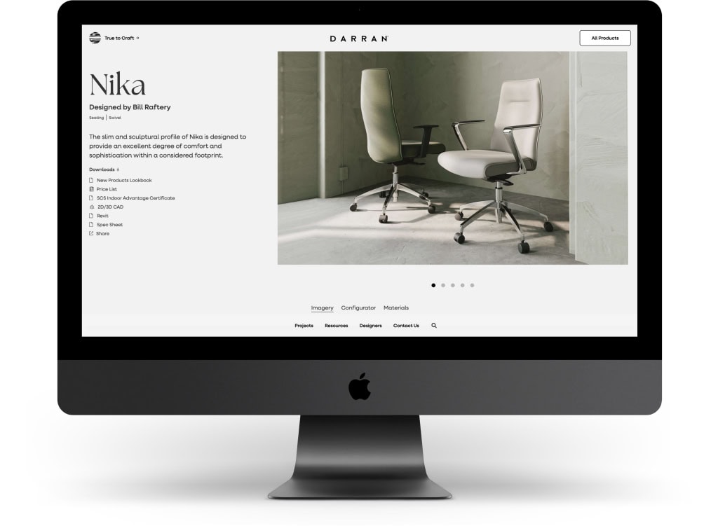 An apple desktop computer sits on a white background and shows the sleek design of the DARRAN's product page for the Nika chair.