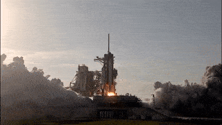 Gif of a NASA launch, craft leaving ground with flames sending it upwards