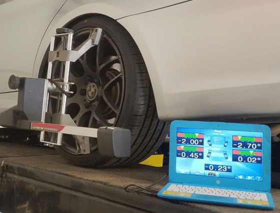 Wheel alignment being performed on a luxury car at Maryland Motor Werkz, specializing in precision a.