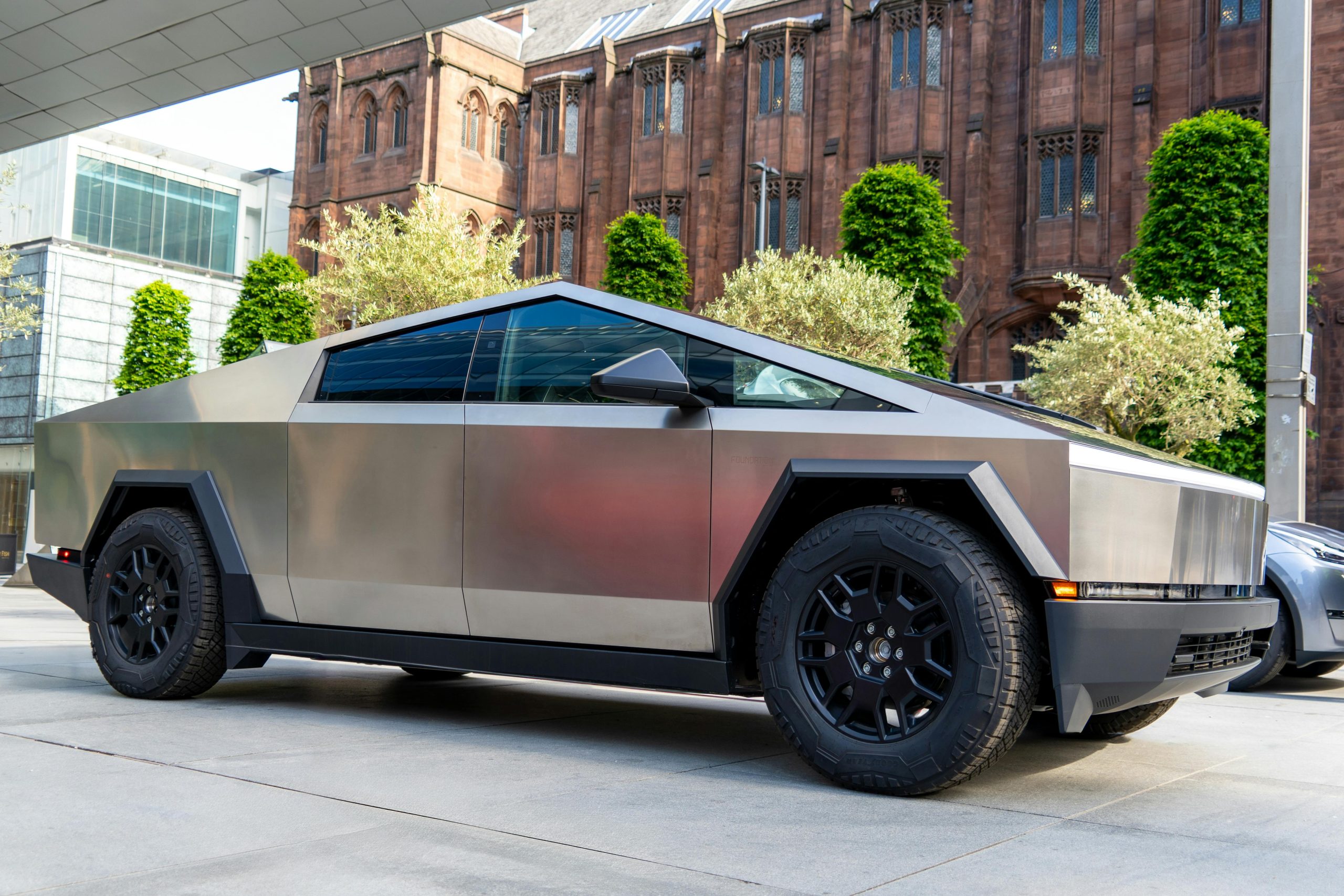 Tesla Cybertruck electric vehicle with a modern, angular design and matte finish.