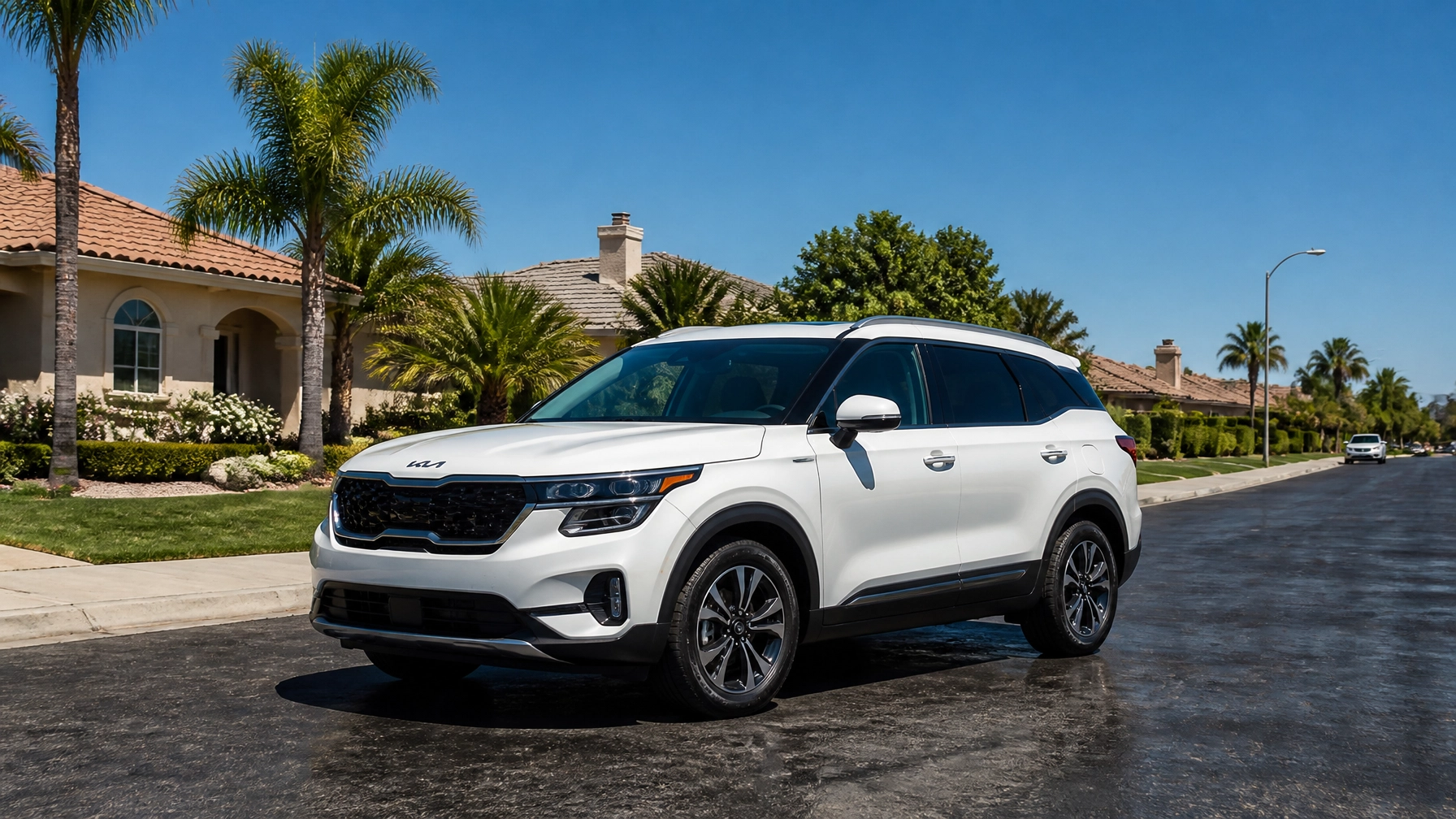 White Kia Sorento parked on a sunny street in Fresno, CA.