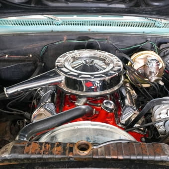 Close-up of vintage car engine at Meineke Car Care Center Fresno.