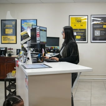 Customer service representative assisting at Meineke Car Care Center Fresno.