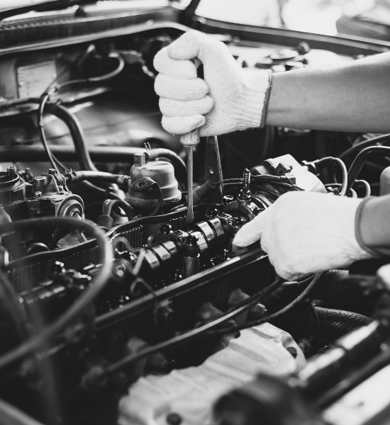 Technician repairing engine components at Meineke Car Care Center Fresno.