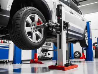 Vehicle wheel alignment being performed at Mickey's Automotive, Inc.