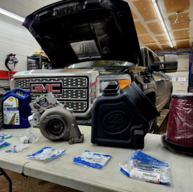 Vehicle engine being serviced with tools and equipment at Minotaur Mechanical.