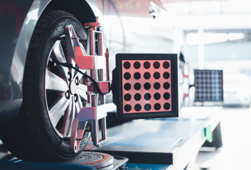 Vehicle wheel alignment being performed at MNS Auto Services in Valley.