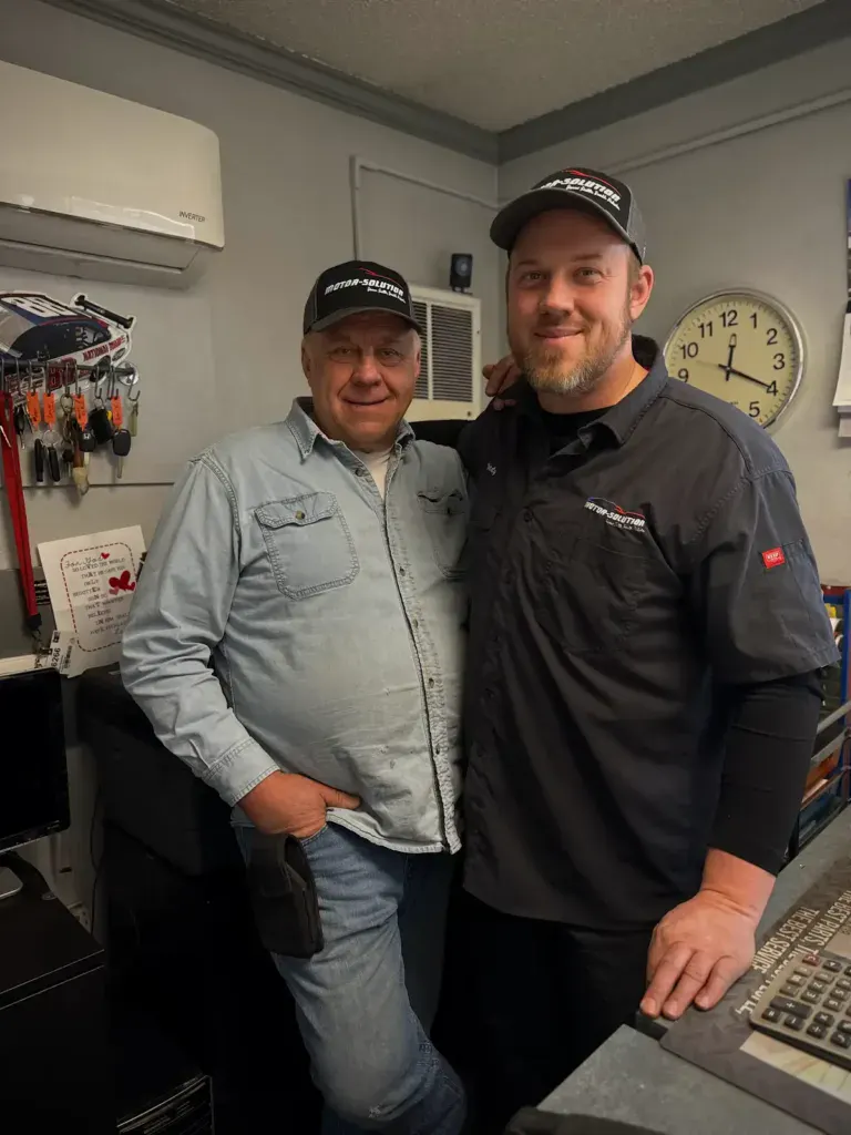 Two team members at Motor Solution, showcasing customer service and automotive expertise.