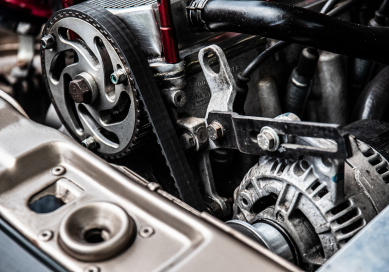 Engine timing belt and pulleys in a high-performance vehicle.