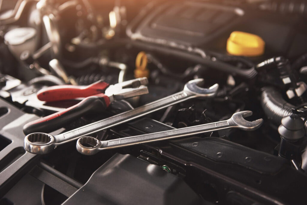 Automotive diagnostic tools on engine for check engine light troubleshooting.