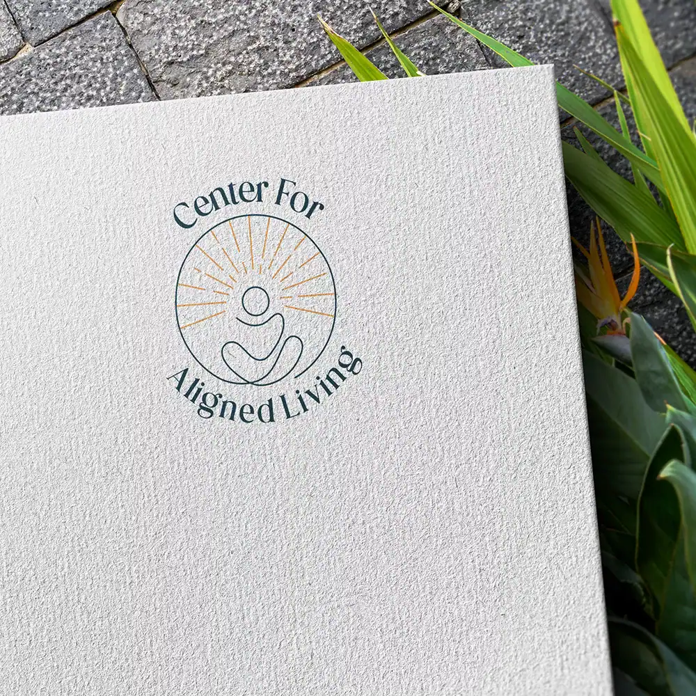 Centered logo for Center For Aligned Living, promoting holistic wellness and mindfulness.