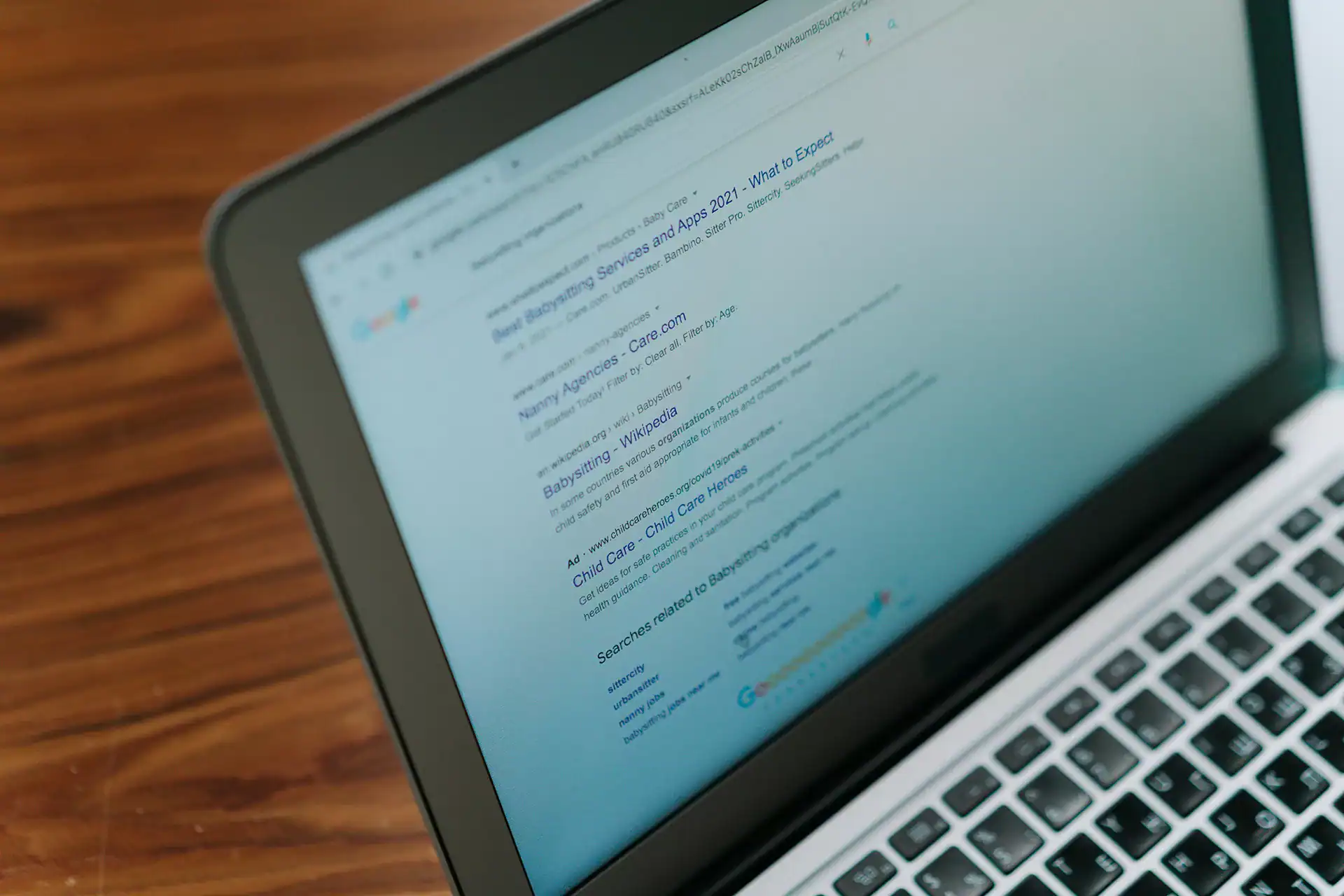 Responsive digital marketing agency website on laptop screen, SEO, branding, and online advertising services.