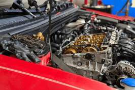 Engine being serviced during an oil change at Mundo Auto Repair.