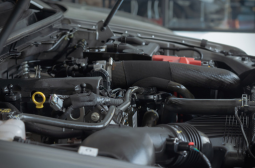 Close-up of a car engine during repair at Nate’s Gona Fix It.