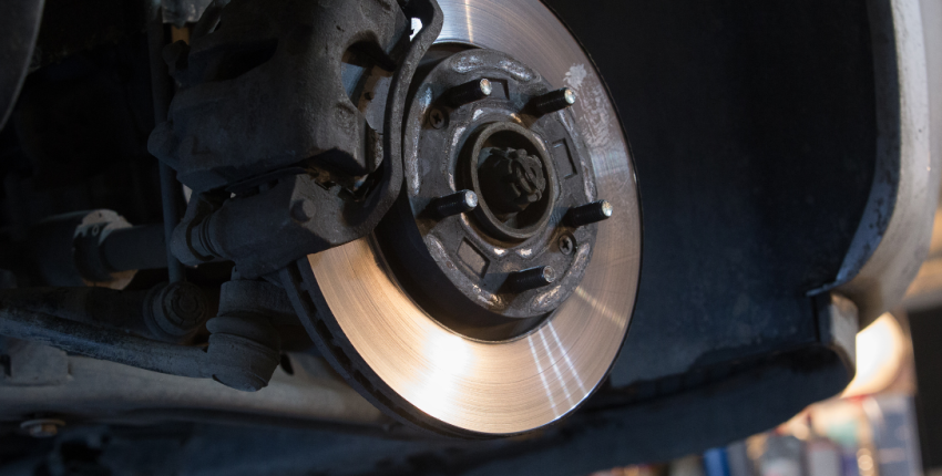 Brake disc and caliper repair image for vehicle maintenance.