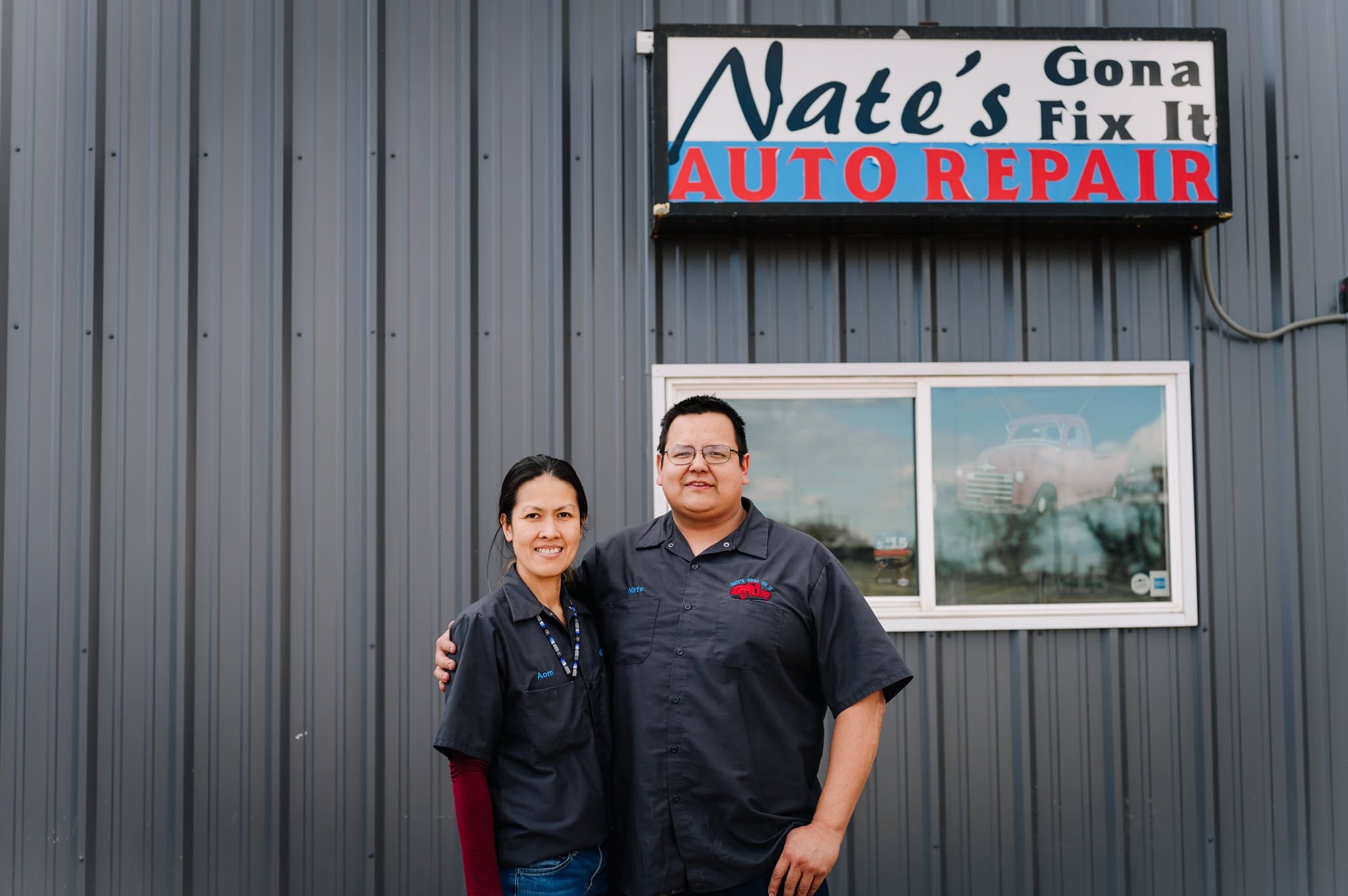 Auto repair shop team standing outside Nate’s Gona Fix It, a trusted local auto repair business.