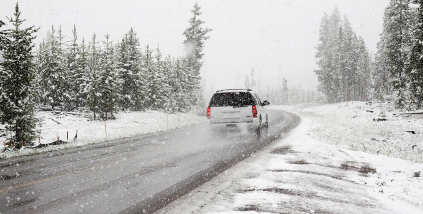 Winter car driving on snowy road in Mississauga.