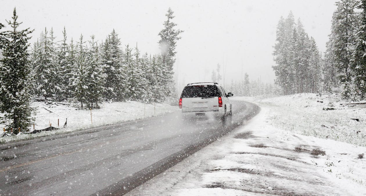 Winter car driving on snowy road in Mississauga.