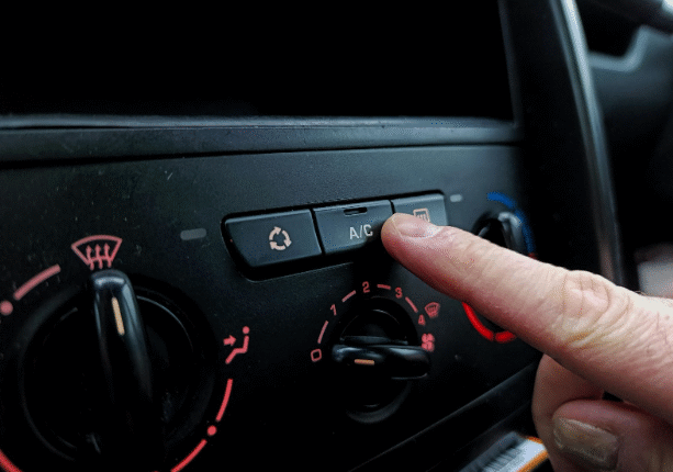 Car A/C panel showing temperature and airflow controls.