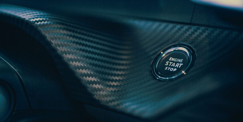 Engine start/stop button in a modern car interior.