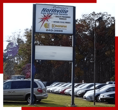 Northville Auto INC service sign with contact info.