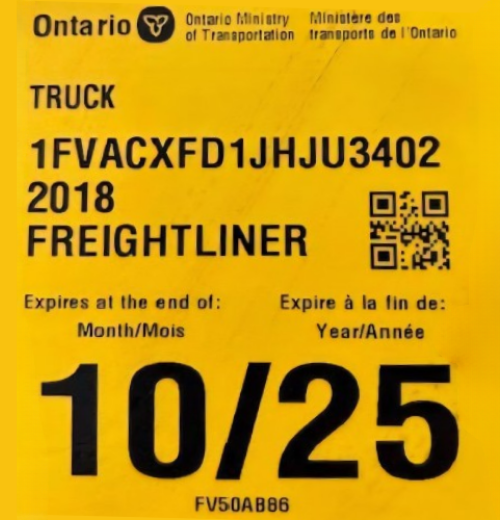Freightliner truck license plate with Ontario Ministry details and expiration date.