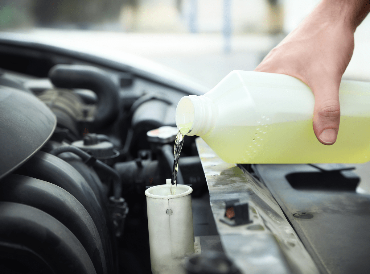 Oil change being performed on a vehicle at One Stop Lube.