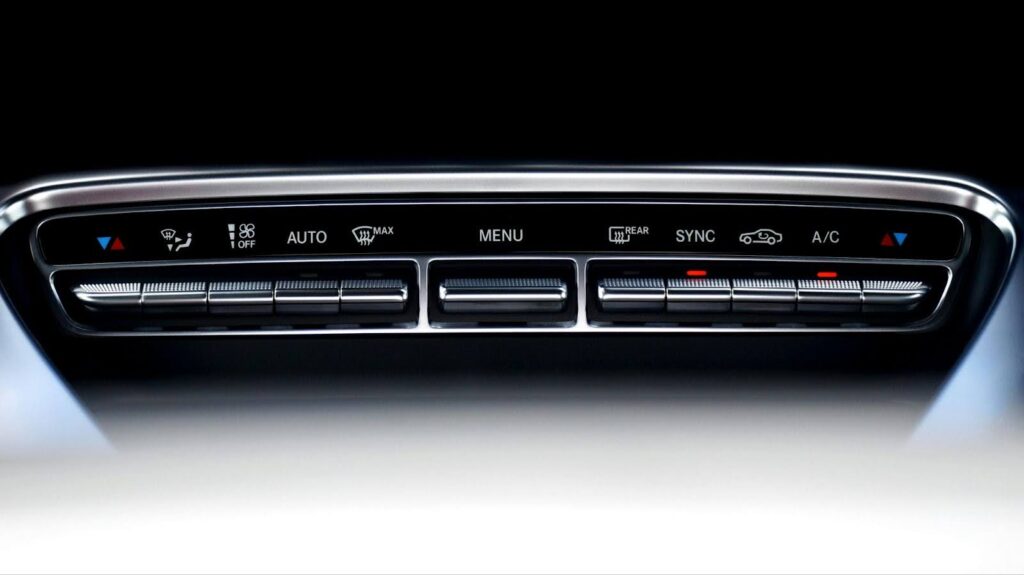 Auto AC control panel with temperature and airflow settings for efficient vehicle climate control.