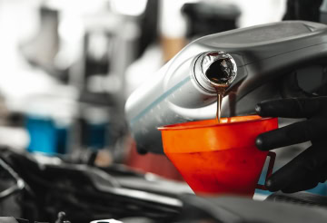 Oil change service at One Stop Lube, auto care experts.