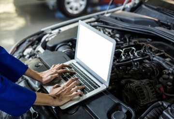 Car engine diagnostic and service at One Stop Lube.