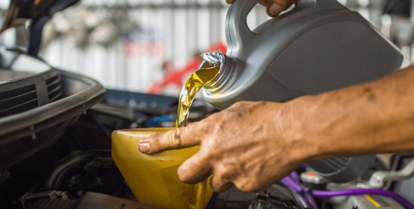 Professional oil change being performed on a vehicle at Orlando Auto Repair.