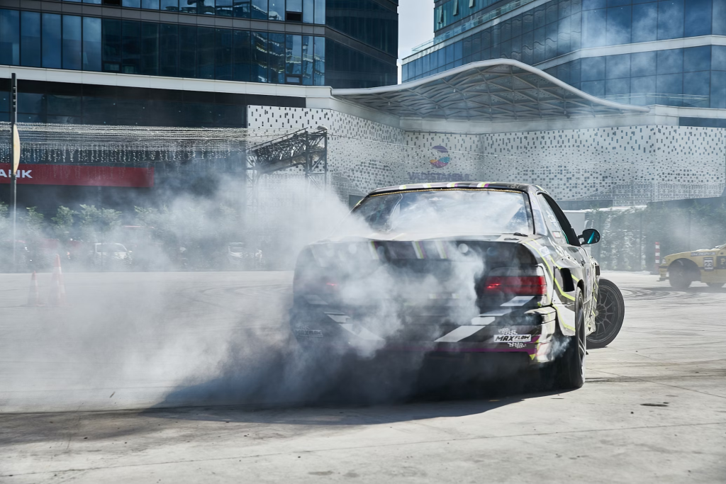 Car performing burnout indicating brake issues in Orlando auto repair shop.