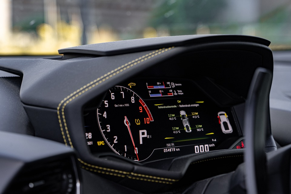 Brake warning light illuminated on car dashboard indicating potential brake issues.