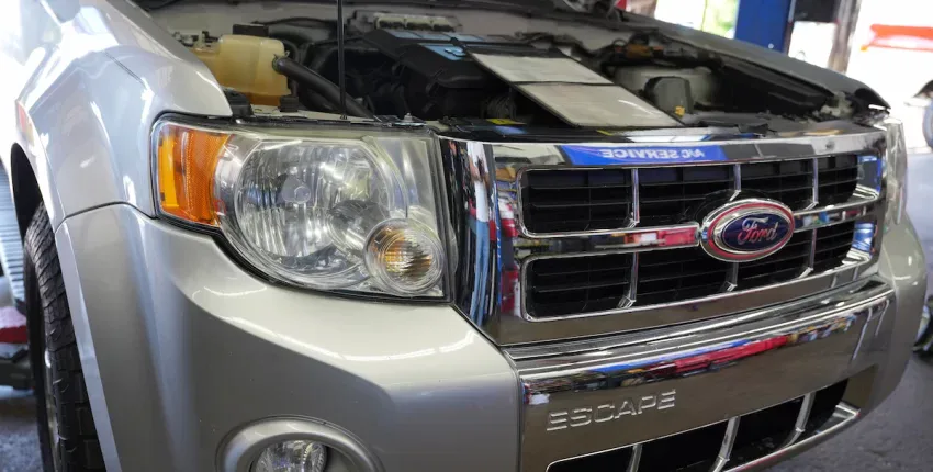 Ford Escape engine with open hood at Orlando Auto Repair shop.